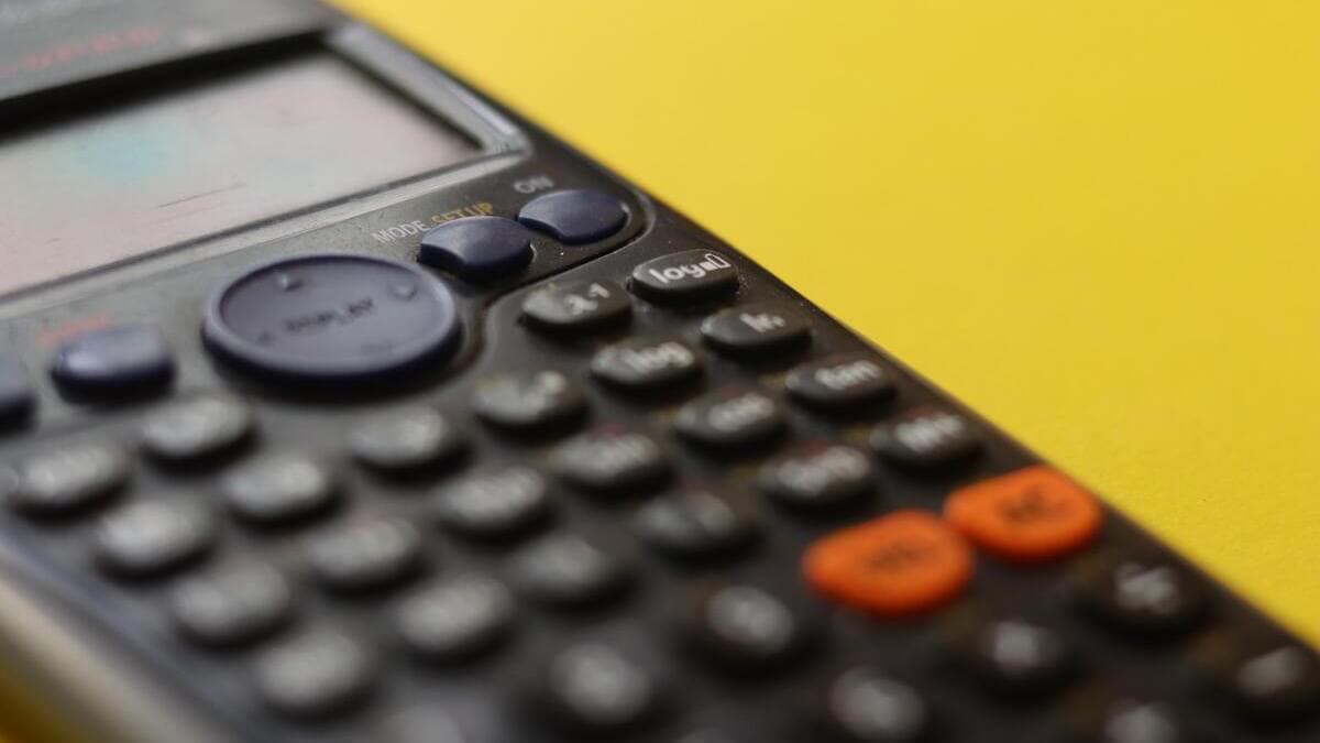 calculator figuring out adjusted gross income on taxes